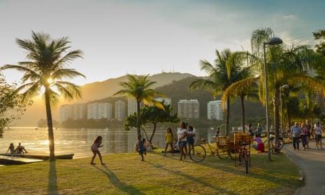 Families relax by Rio de Janeiro’s Lagoa Rodrigo Freitas.